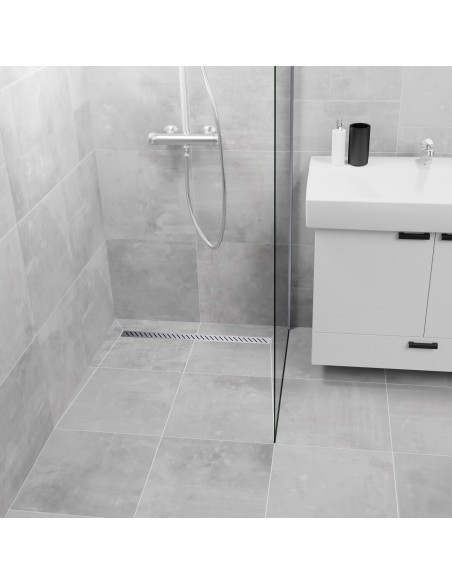 Example of a shower finished with large-format bright tiles and shower glass on one side