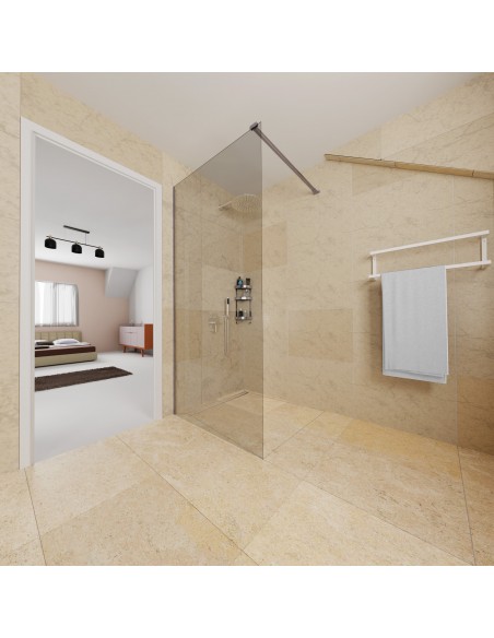 Open bath with a rain head shower, limestone tiles, and modern shower glass with bed room in the background