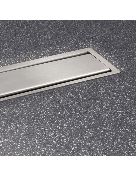 View of a installed wet room tray in dark gray coloured vinyl flooring, including Ponente cover