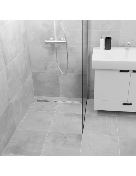 Walk in shower finished with large format bright tiles and shower screen on one side