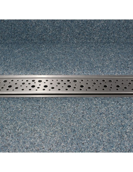 View of a installed wet room tray in blue coloured vinyl flooring with coving, including Mistral - frontal view