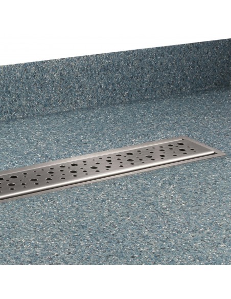 Side view of installed shower drain with design cover Mistral, combined with green-blue vinyl flooring