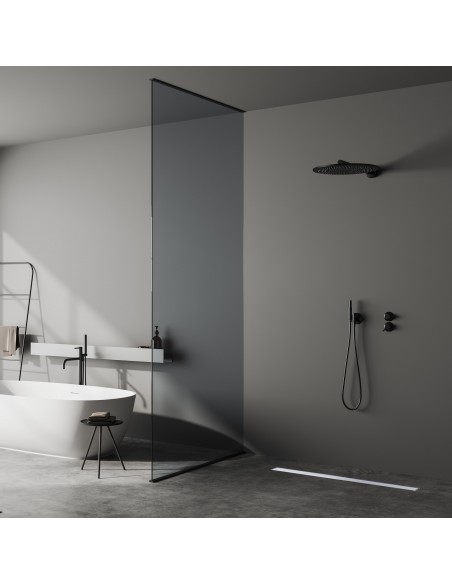 Dark bathroom with microcement floor with a free-standing bath tub and an open shower area - solid cover side