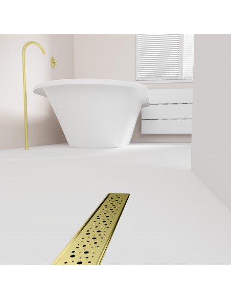 Open bathroom with bathtub and integrated shower drain in Gold in light microcement flooring