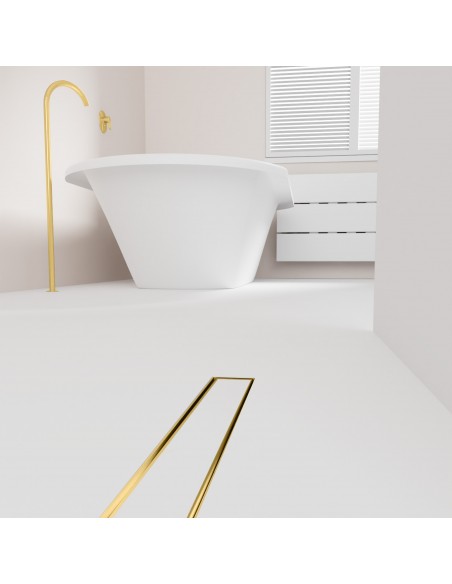Open bathroom with bathtub and integrated shower drain in Brass in light microcement flooring - tiled cover side