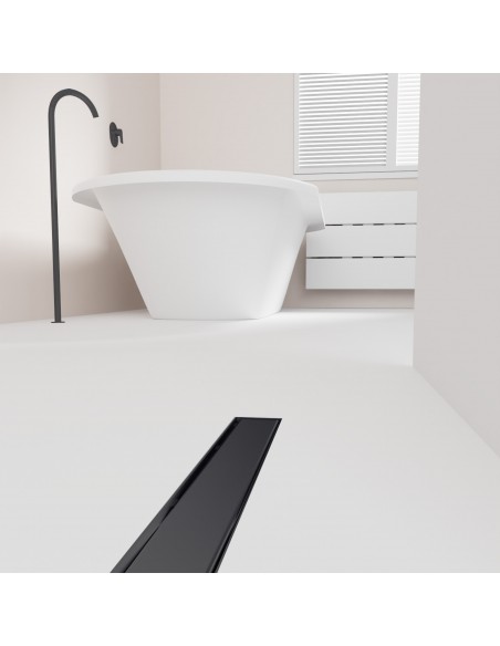 Open bathroom with bathtub and integrated shower drain in Black in light microcement flooring