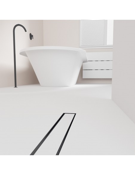 Open bathroom with bathtub and integrated shower drain in Black in light microcement flooring - tiled cover side