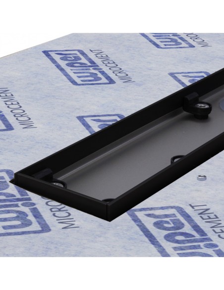 Close up on the drain channel with secondary drainage system and adjustable frame for different tile thicknesses