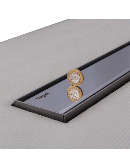Close up on integrated Silver linear drain with matching Ponente cover