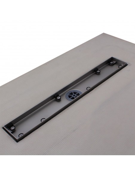 Close up on the drain channel with secondary drainage system and adjustable frame for different tile thicknesses