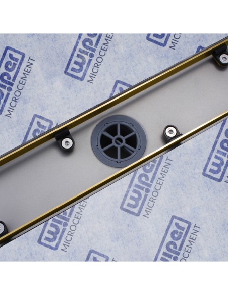 Close up on the drain channel with secondary drainage system and adjustable frame for different tile thicknesses