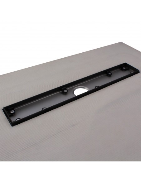 Close up on the drain channel with secondary drainage system and adjustable frame for different tile thicknesses
