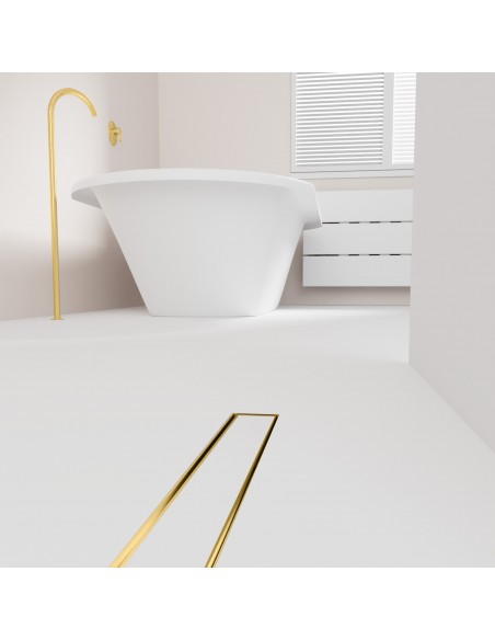 Open bathroom with bathtub and integrated shower drain in Brass in light microcement flooring
