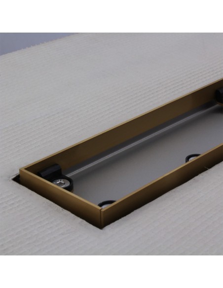 Stainless steel drain body without cover, revealing a centered outlet and adjustable frame for different tile thicknesses