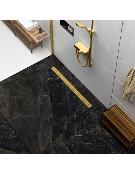 Modern shower area with black marble-look tiles and shower channel and fittings in Brass