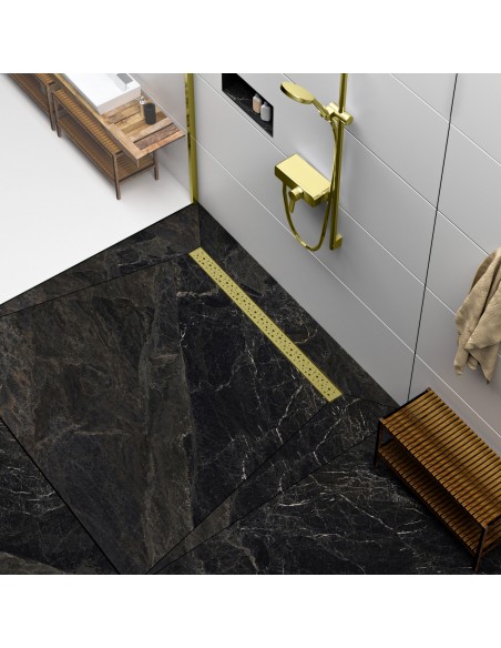 Modern shower area with black marble-look tiles and shower channel and fittings in Gold
