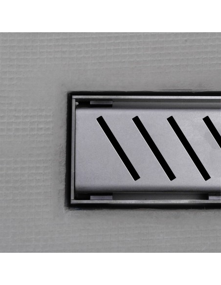 Close up on integrated Silver linear drain with matching Zonda cover