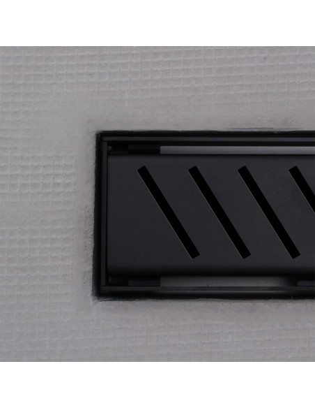 Close up on integrated Black linear drain with matching Zonda cover