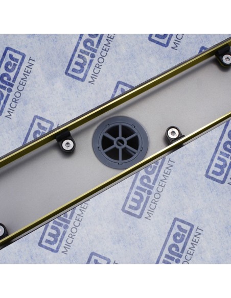 Stainless steel drain body without cover, revealing a centered outlet and adjustable frame for different tile thicknesses