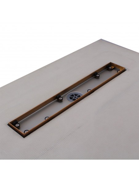 Close up on the drain channel with secondary drainage system and adjustable frame for different tile thicknesses