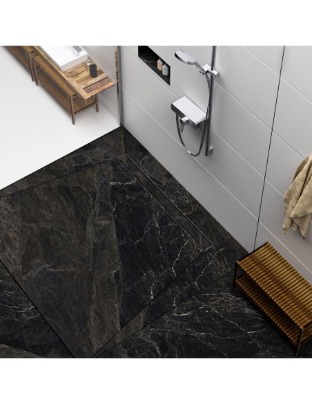 Modern shower area with black marble-look tiles and shower channel and fittings in Silver