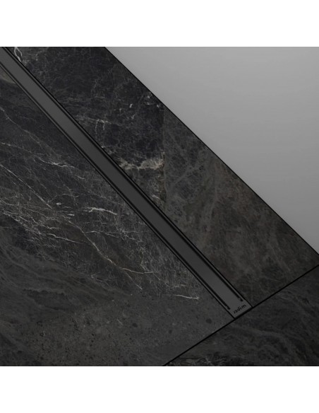 Example of a built-in slim and modern looking INTENSI 316 linear drain in Graphite in black marble floor