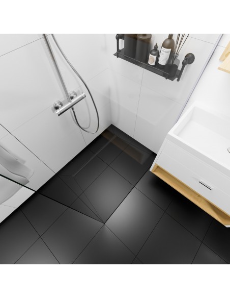 Example: View from above on a black and white shower area featuring INTENSI 316 linear channel in Graphite